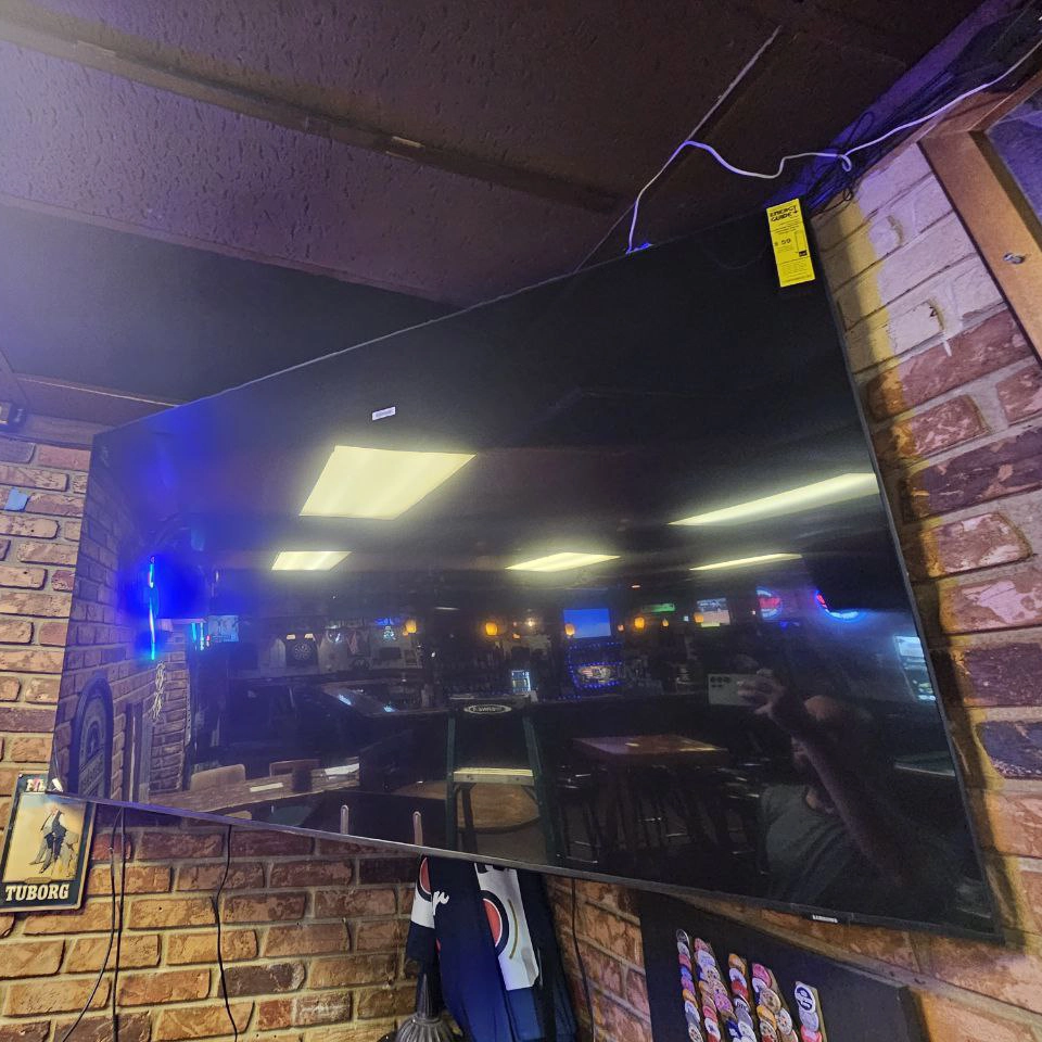 Mounted TV with floating shelf installation in Fort Lauderdale