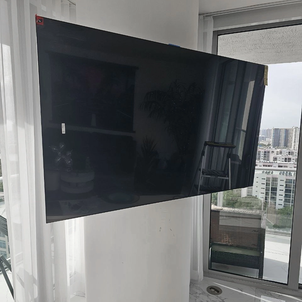 Home theater setup with mounted TV and sound system
