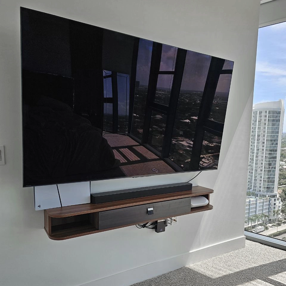Modern TV wall mounting with shelf installation in Fort Lauderdale