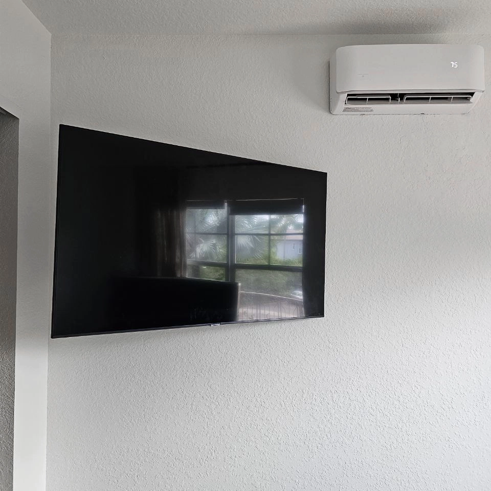 Flat screen mounted with cable concealment in wall