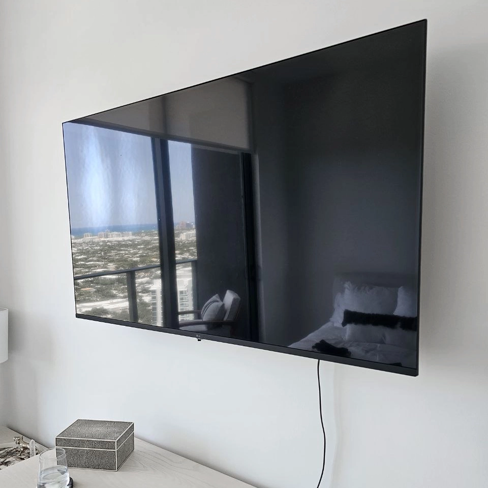 TV mounting and floating shelf installation with cable management