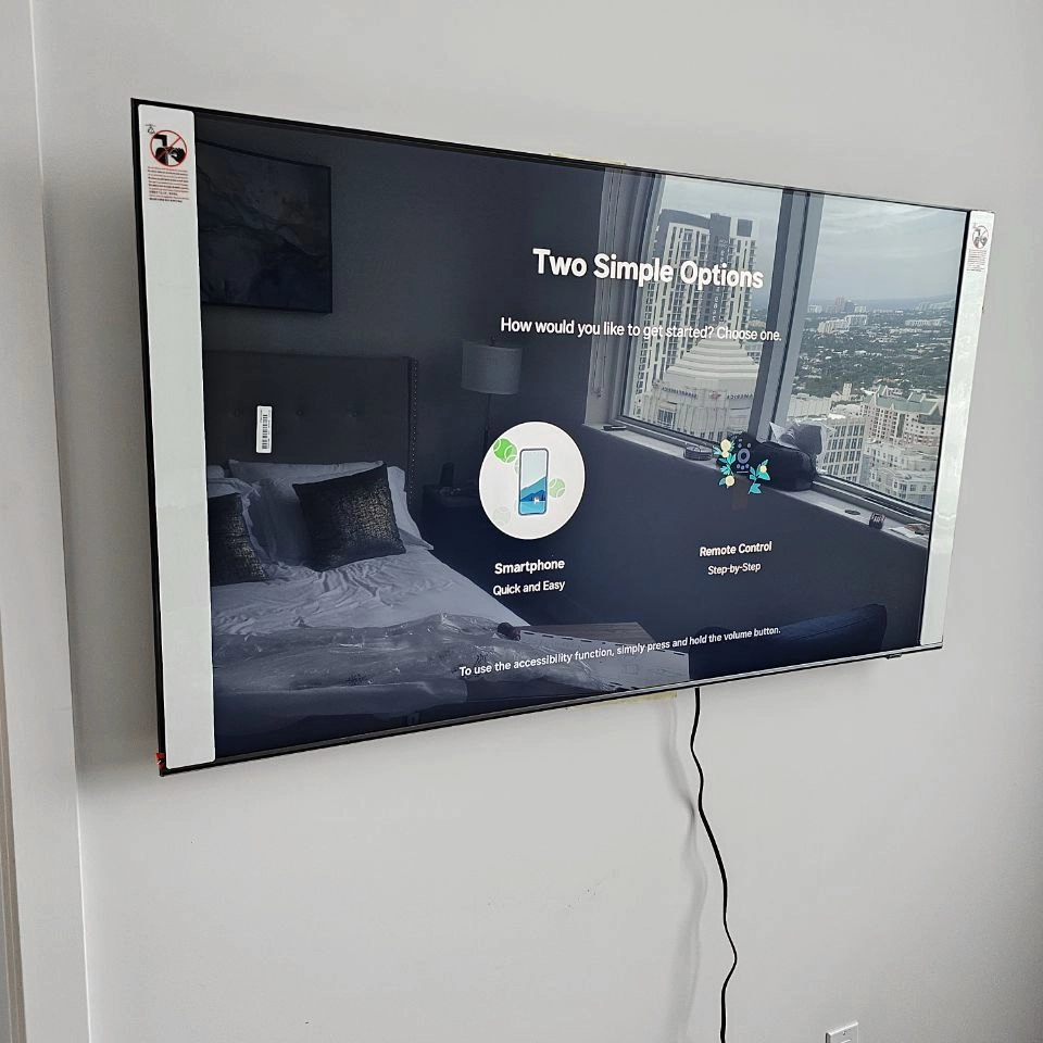 Wall-mounted TV installation with cable concealing