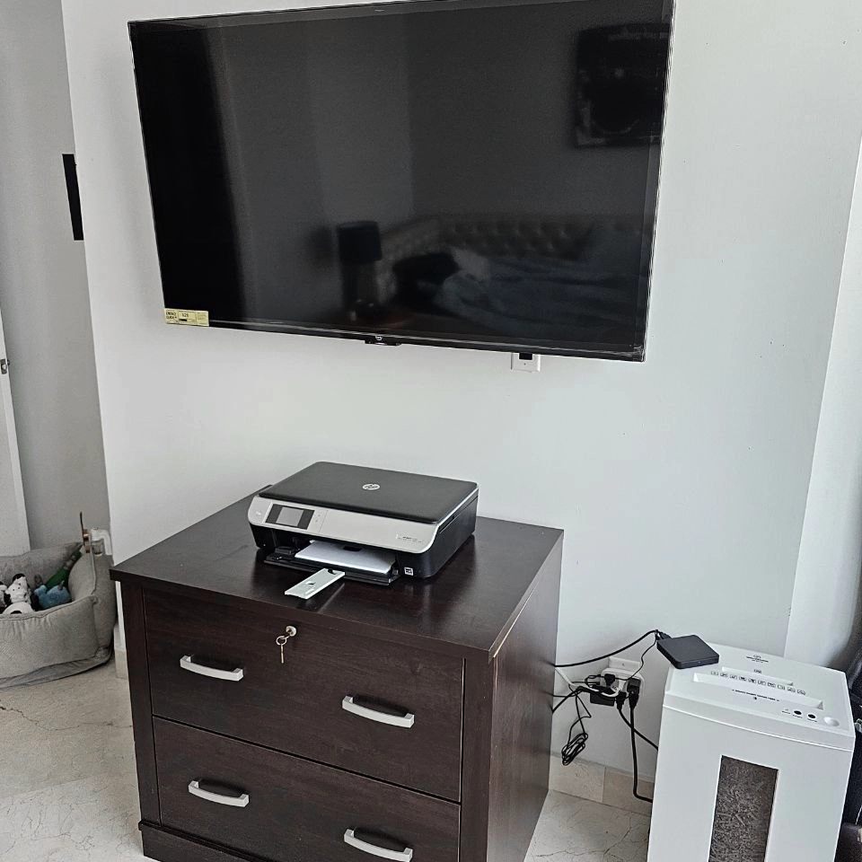 Floating TV stand installed with wall-mounted flat screen